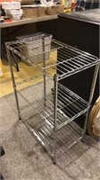 Chrome storage rack trip with three shelves all