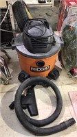Ridgid 34 L shop vac with the hose, Powers on