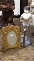 Wood doll dress display piece and a photo frame