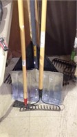 Four yard tools including snow shovel, leaf rake,