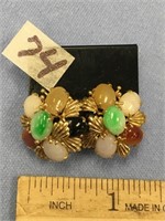 Pair of gold earrings set with colored stones