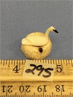 Ivory bird on a bone carved nest with 2 ivory eggs