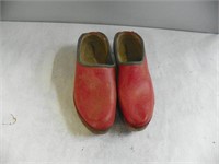 Pr of red wooden shoes
