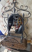 Beautiful entry mirror and iron work with wicker