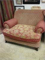 Large red and gold cushioned armchair