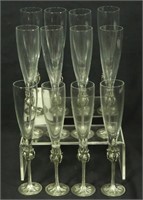 TWELVE ART NOUVEAU PEWTER STEMMED CHAMPAGNE FLUTES