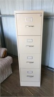 Four drawer tan metal filing cabinet