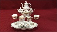 Group Including 2 Decorated Teapots, Creamer &