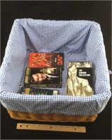 Laundry Basket with several VHS tapes.