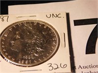 1887 Morgan silver dollar, may be uncirculated