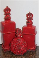 Three Muted Red Ceramic Containers