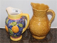 Two Ceramic Pitchers with Raised