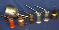 6 Vintage Oil Cans and 1 Metal Funnel