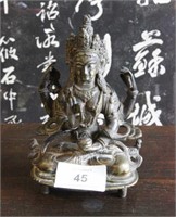 Bronze figure of a four armed deity, holding an