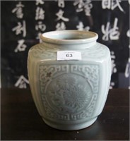4 sided celadon jar decorated with 4 roundels of