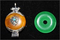 Tibetan amber pendant with silver mounts,