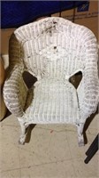 Small white wicker child's rocking chair