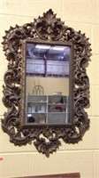 Goldtone fancy plastic framed wall mirror,