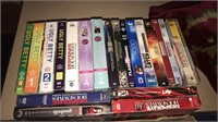 Box of DVDs mostly box sets of multiple DVDs in a