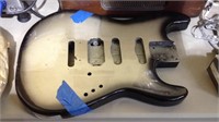 Silver and black painted wood guitar body just