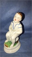 Porcelain boy on the pot jar, 7 1/2 inches tall