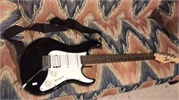 Yamaha electric guitar model EG1 12 has a