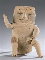 Quimbaya seated male figure.