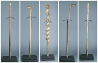 5 wooden canes / staffs.