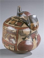 Nasca stirrup vessel with figurative form.