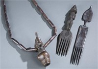 2 combs and one necklace with figure. c.20th.