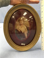 Oval picture of a baby               (K15)