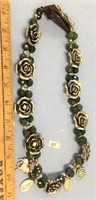 Jade and silver necklace with assorted religious s