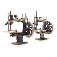 Two toy Singer sewing machines