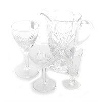 Assortment of colorless stemware and pitchers