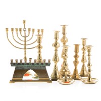 Brass candlesticks and menorahs