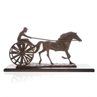 Metal sculpture of sulky horse and rider