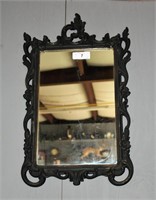 Wood framed carved mirror