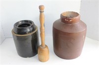 Two crock jars with wood masher
