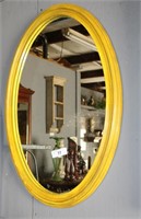 Oval wood framed mirror