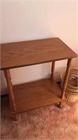 Side table with wicker trash can