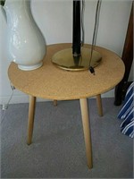 Round nightstand table measures 23 inches tall by