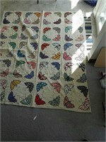 Vintage quilt hand-sewn applique of butterflies,