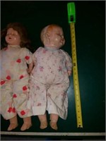 A pair of vintage dolls not in very good shape,