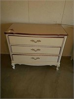 Three drawer dresser measures 31 inches tall 36