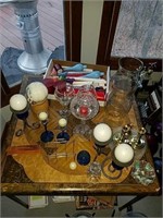 Tabletop full of candle holders very unique some