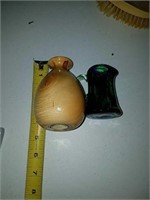 A small wooden vase and a small multi colored