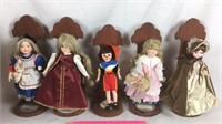 Five Dolls on Wood Stands