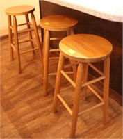 3 WOODEN BAR STOOLS AND A DESK CHAIR