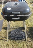 Light portable charcoal grill.