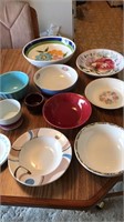Collection of serving bowls and bread plates